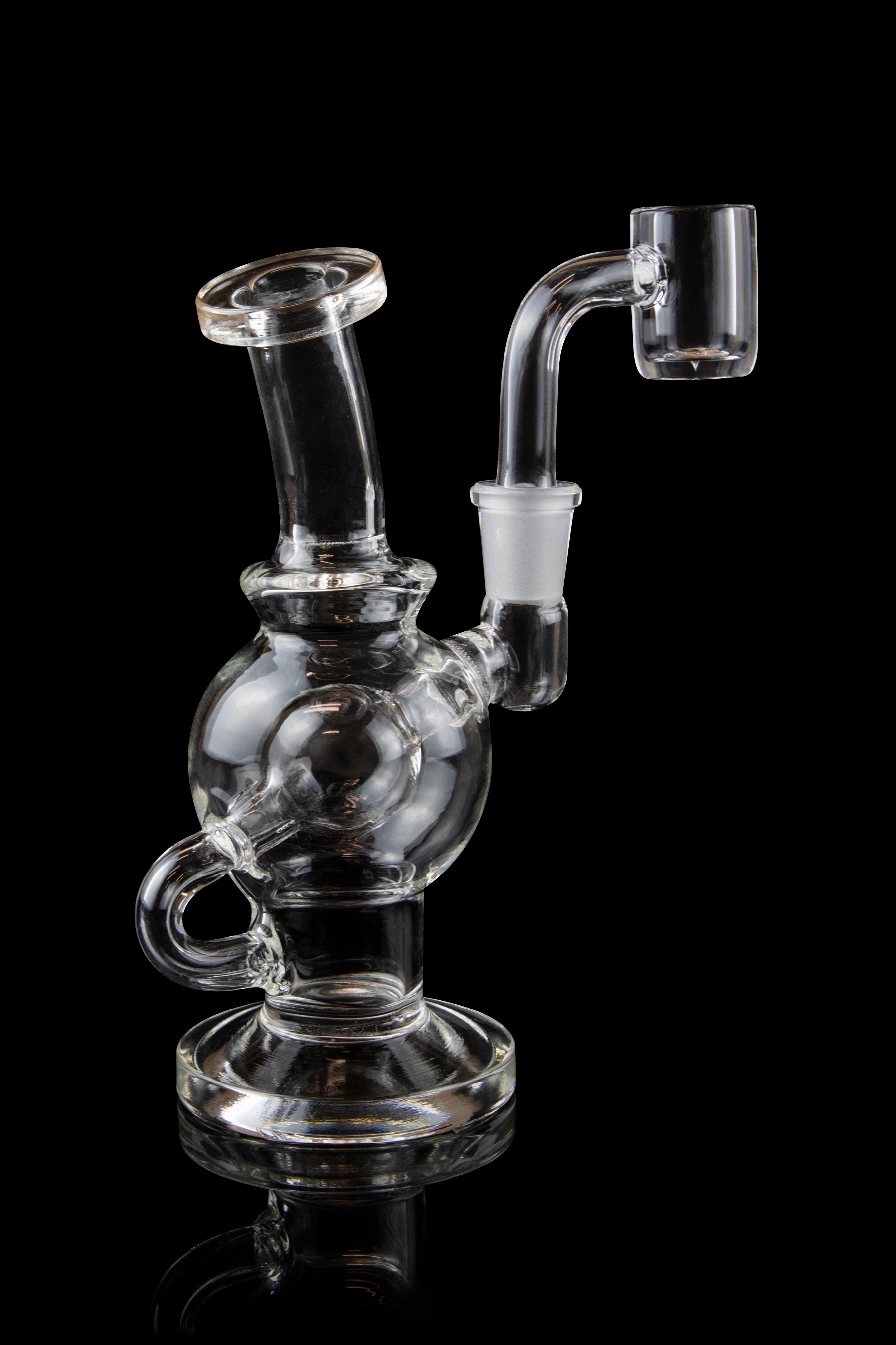 Clear glass water pipe (rig) with a domeless titanium nail, isolated on a black background.