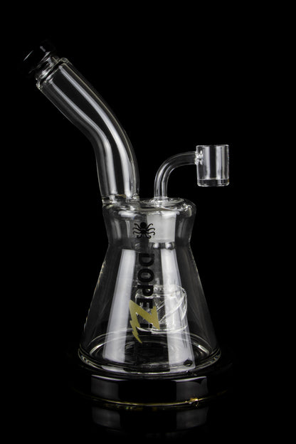 Glass water pipe (bong) with intricate design and clear glass, isolated on a black background.