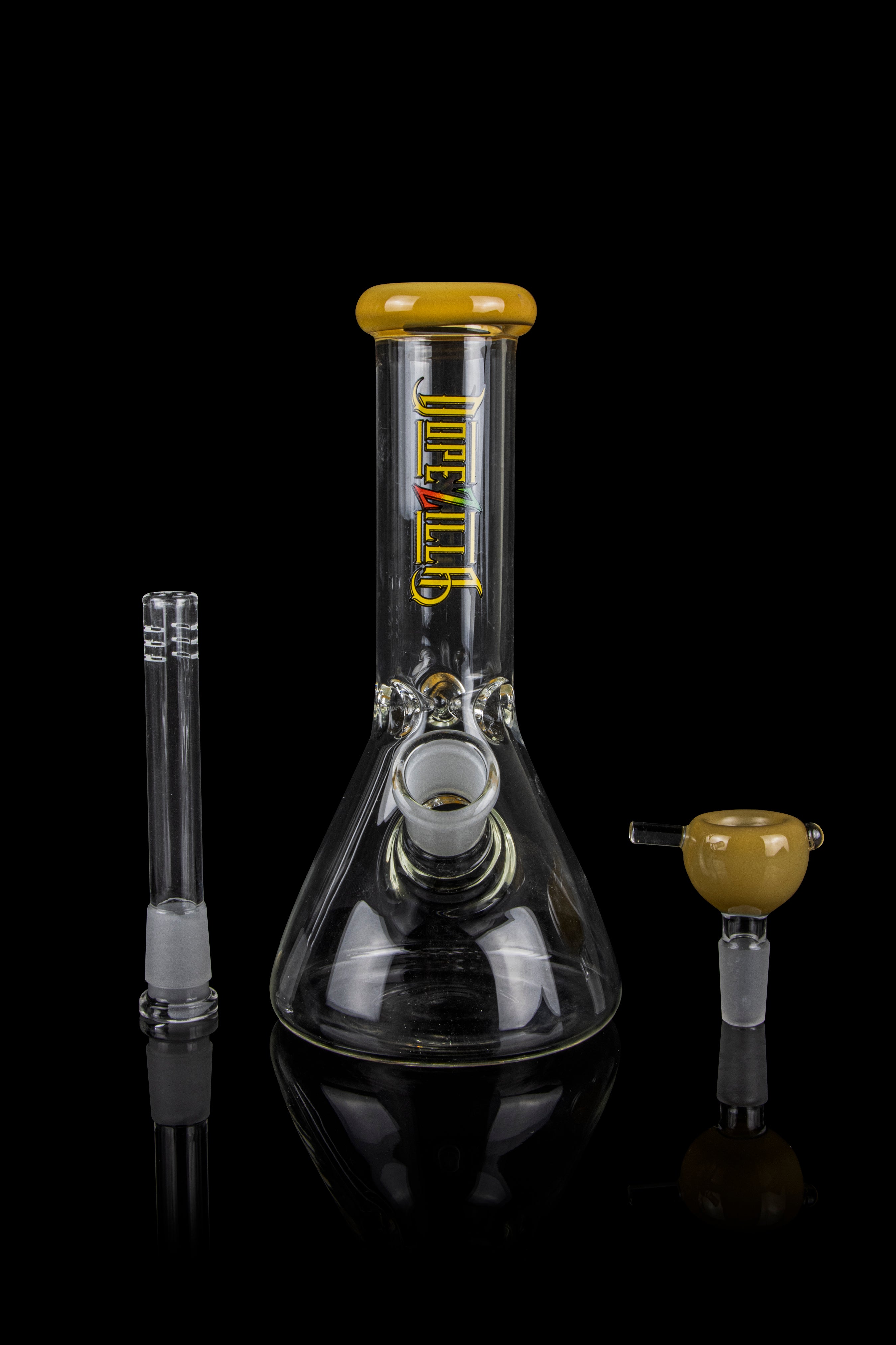 Glass bong with downstem and bowl, featuring gold accents and branding.