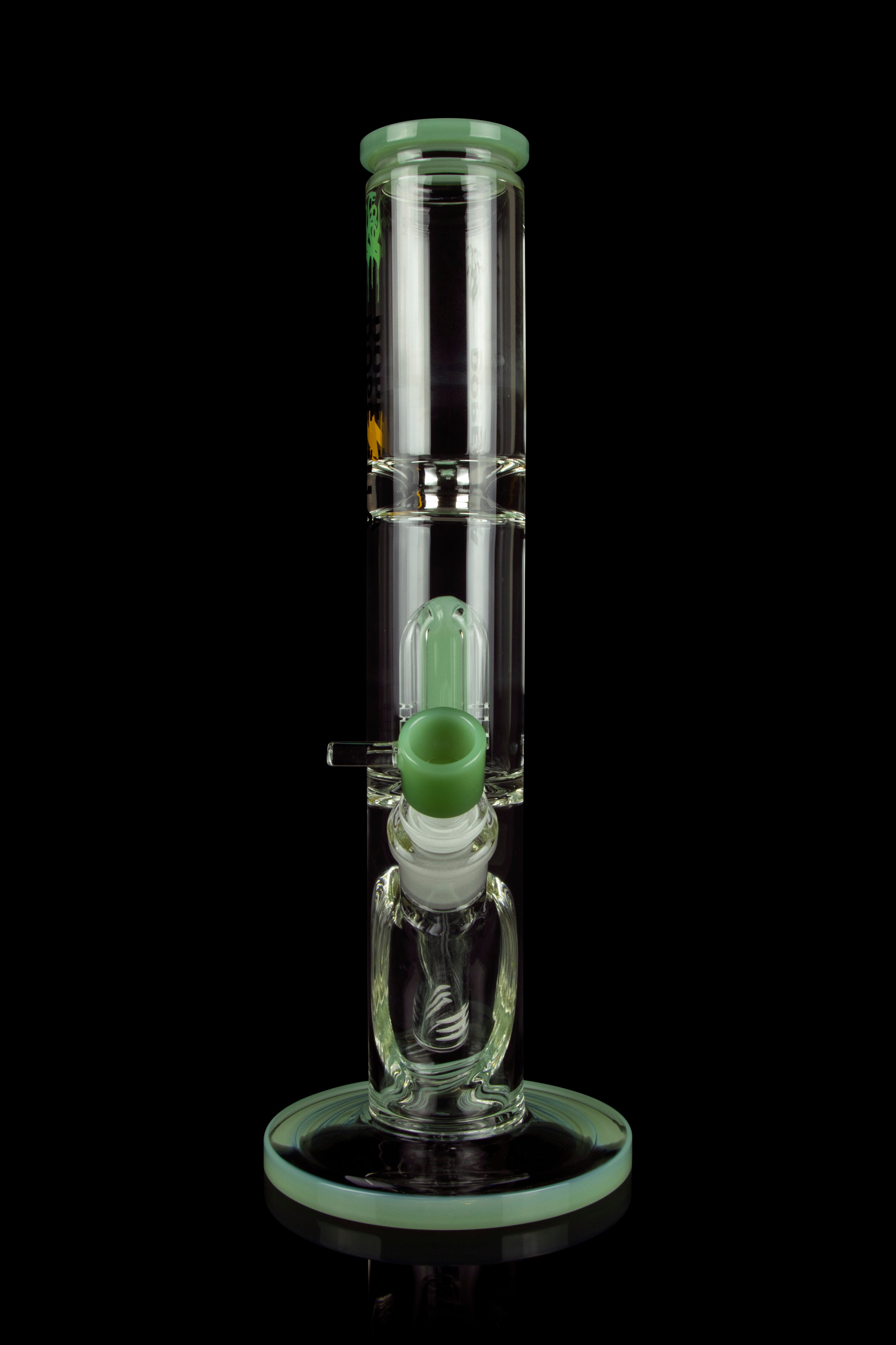 Green glass water pipe (bong) with percolators, isolated on a black background.