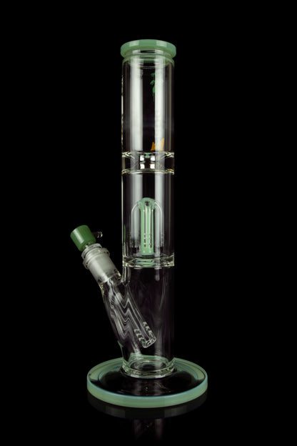 Green glass water pipe (bong) with intricate percolator design, isolated on a black background.