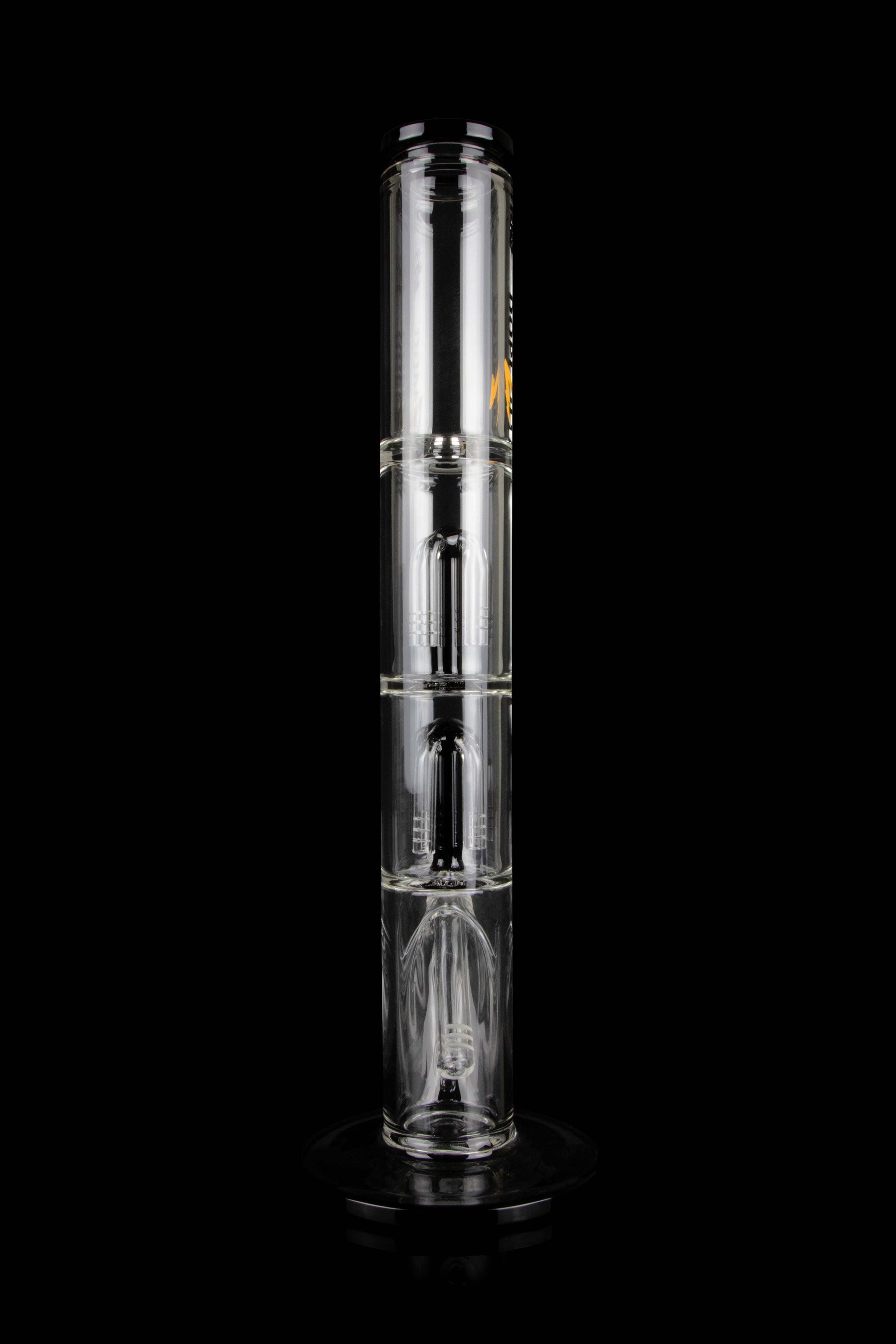 Clear glass bong with multiple chambers and percolators, isolated on a black background.