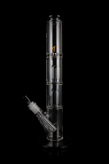 Glass water pipe (bong) with multiple chambers and a downstem, isolated on a black background.