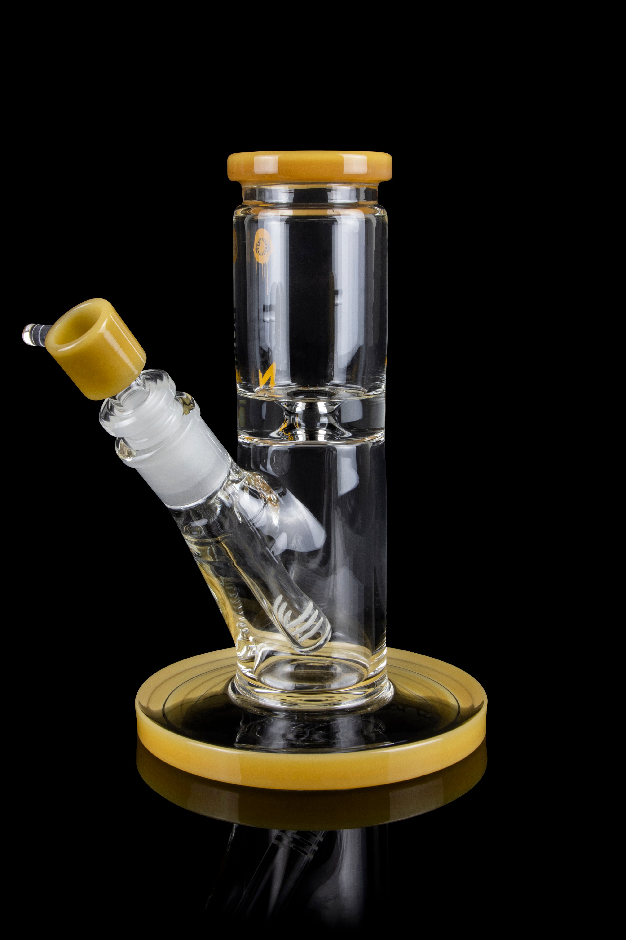 Glass water pipe with a beige mouthpiece and base, reflecting on a black surface.