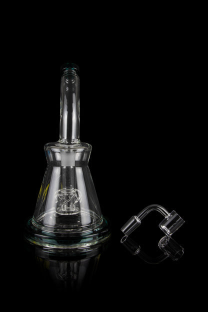 Clear glass rig with intricate percolator and accompanying quartz banger, isolated on a black background.