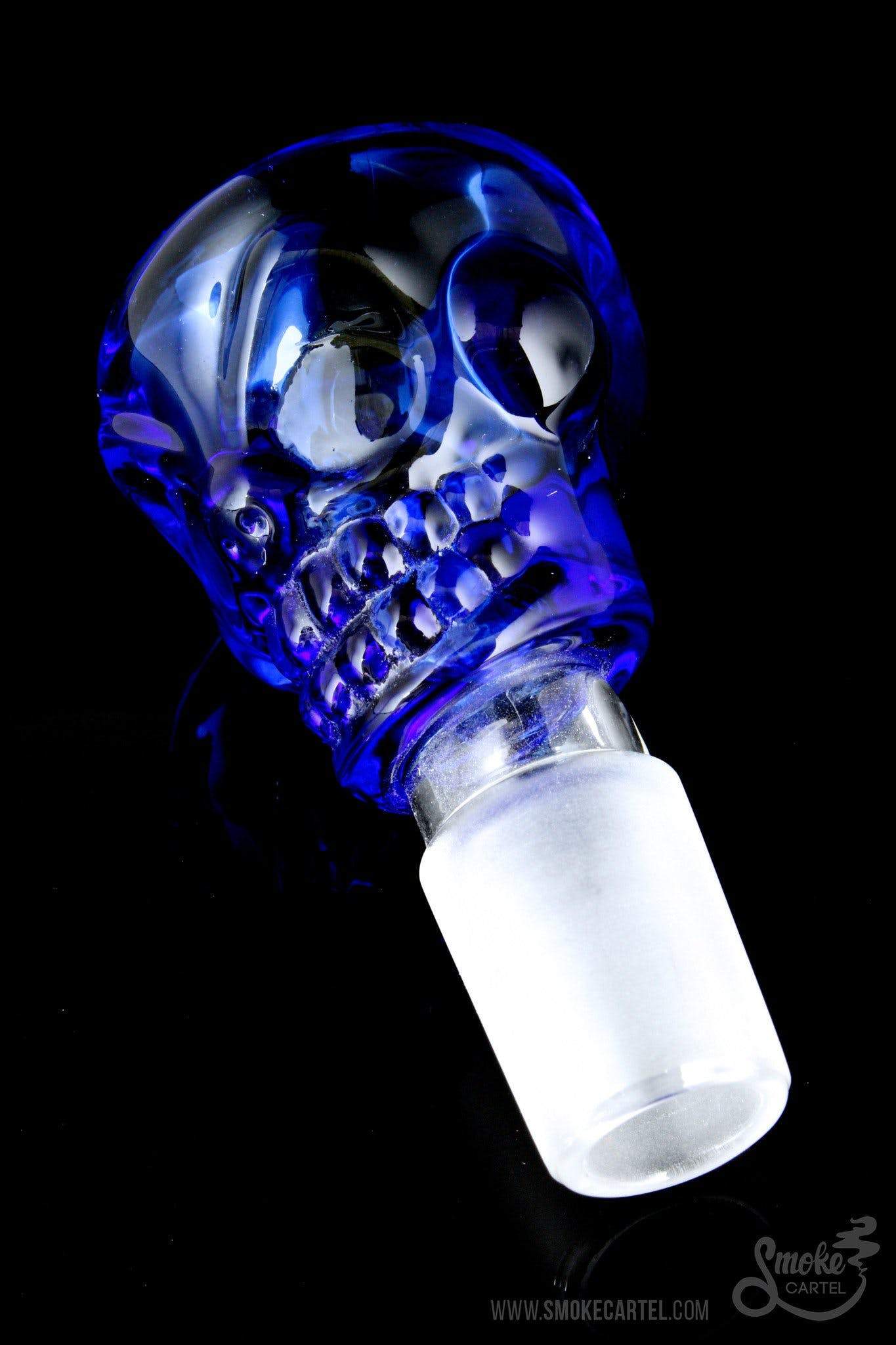 A detailed view of “The Skull” Bowl Slide, featuring a sculpted, translucent blue glass skull design.