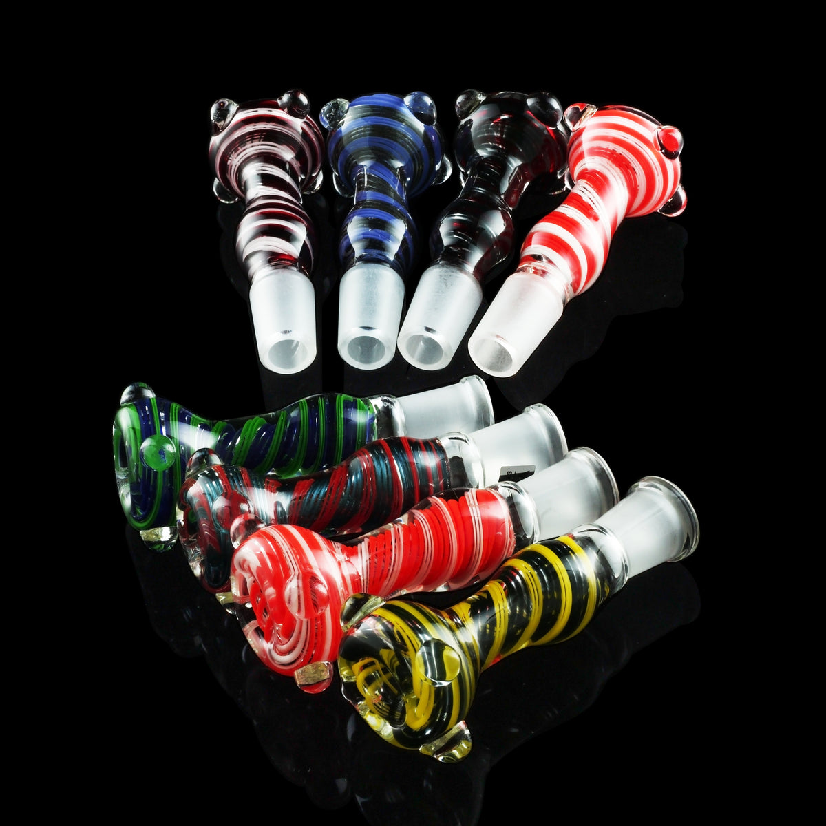 Colorful glass smoking pipes arranged against a black background.