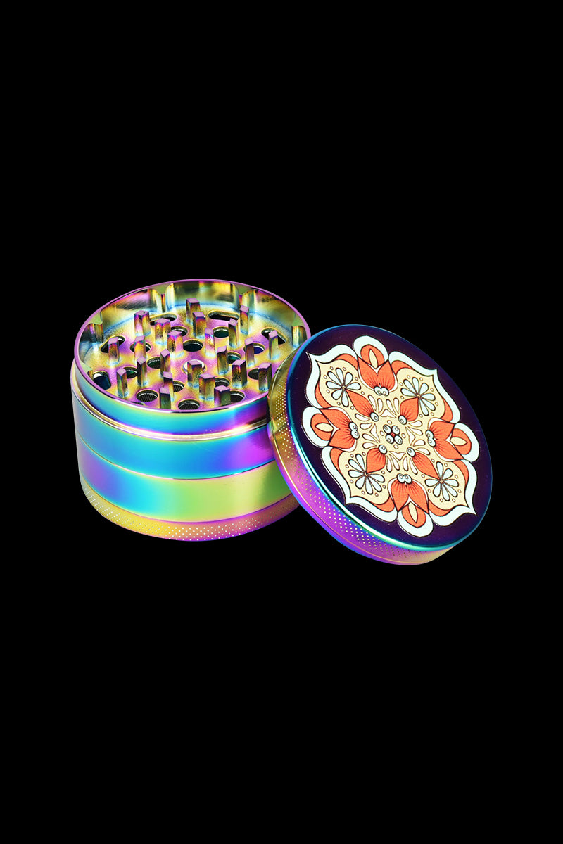 A slightly angled, top-down view of the Mandala Anodized Grinders - 6 Pack, showcasing their iridescent finish and circular design.