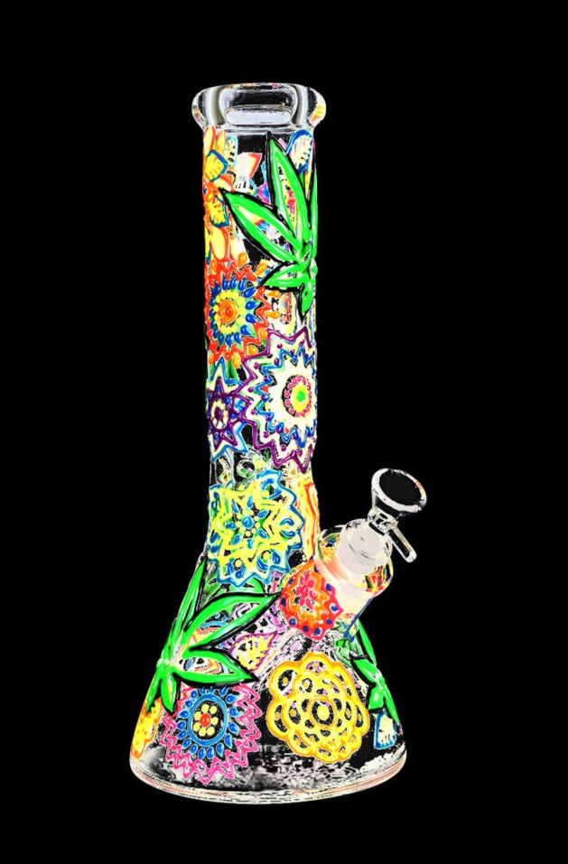 Front view of the Mandala Hemp Leaf Glow In The Dark Beaker Water Pipe, displaying a vibrant, patterned glass design.