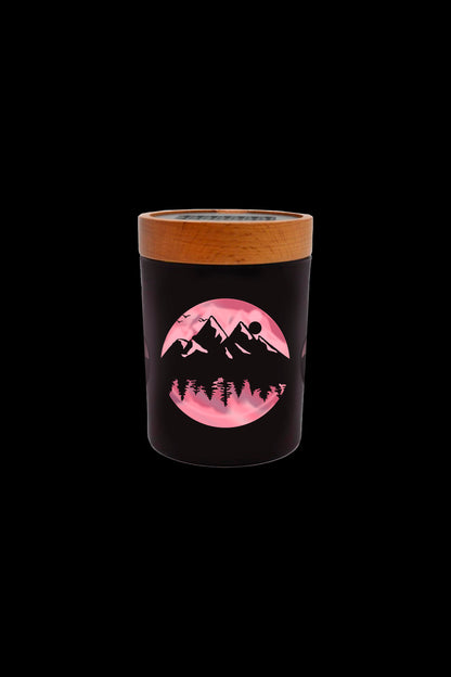 Black cannabis jar with a mountain and moon design.