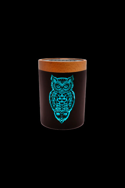 Black smell-proof container with a glowing blue owl design and a wood-grain lid.