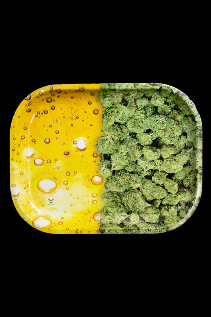 Cannabis bud and resin-covered rolling tray with a split yellow and green design.