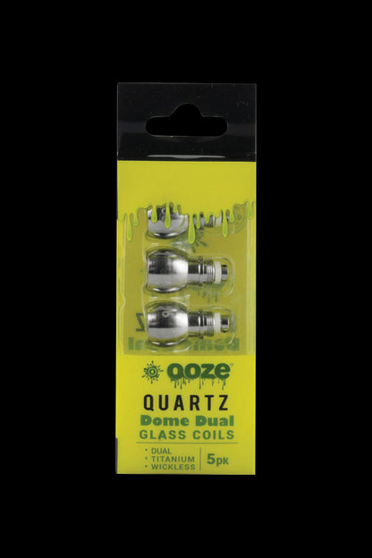 A close-up of the 5-pack of Ooze Dual Quartz Glass Dome Coils against a black background, showing the clear glass and metallic components.