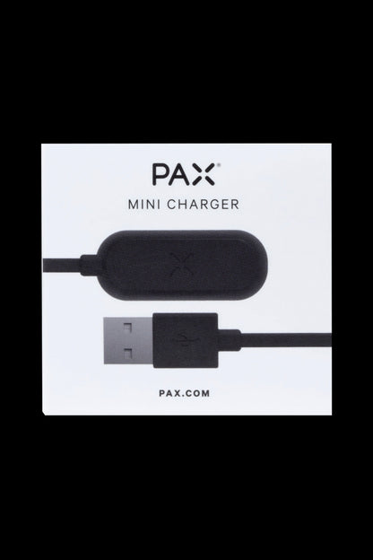 PAX mini charger with USB connection on a white card. <start_of_image>