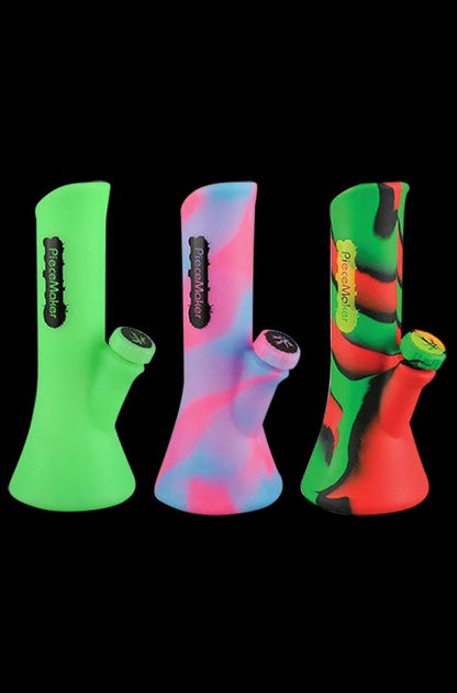 A front view of the PieceMaker Water Pipe - Kali, a sleek, green glass water pipe with a simple, curved design.