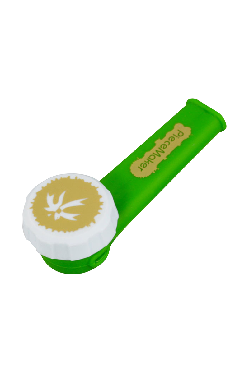 A close-up shows the PieceMaker "Karma" Silicone Pipe in a vibrant green hue, angled slightly from above.