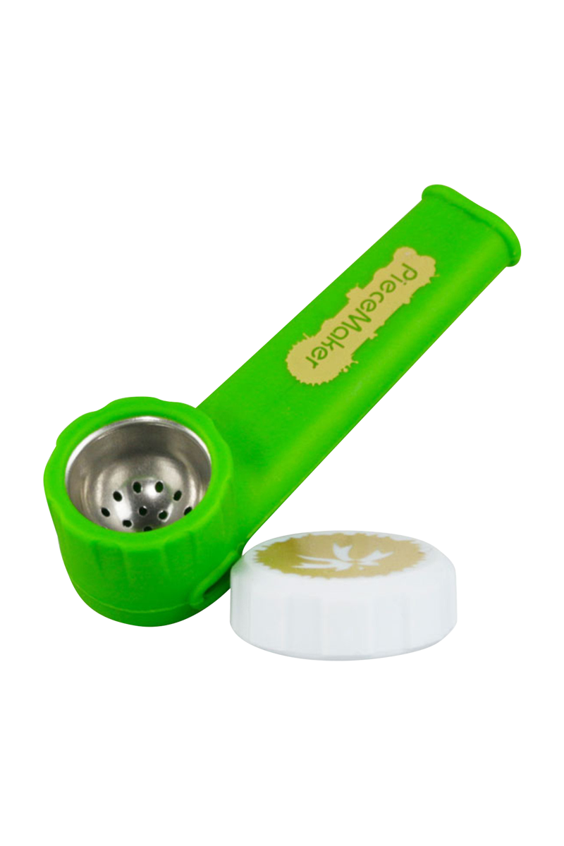 A side view of the PieceMaker "Karma" Silicone Pipe, showing the curved mouthpiece and textured green body.