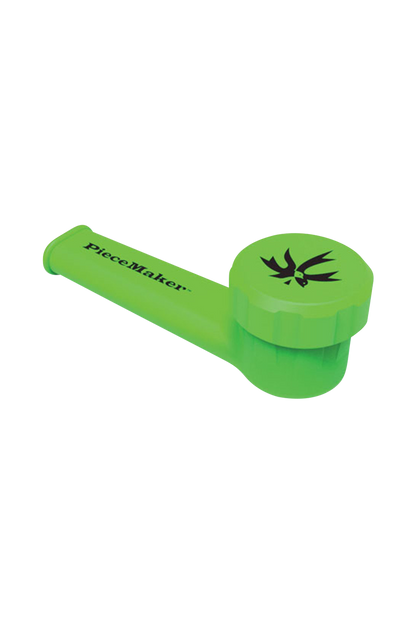 A vibrant, angled close-up of the PieceMaker "Karma" Silicone Pipe, showcasing its curved design and smooth, green texture.