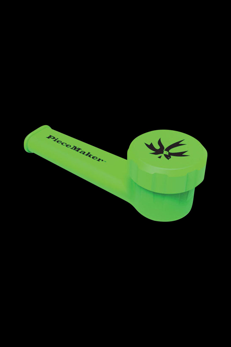 A close-up view of the PieceMaker "Karma" Silicone Pipe, showcasing its curved design and smooth, green finish.