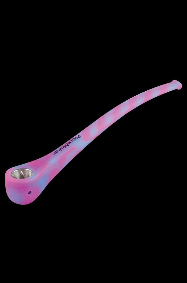 A close-up, angled view of the PieceMaker Konjurer Silicone Pipe, showing its curved design and smooth, dark finish.