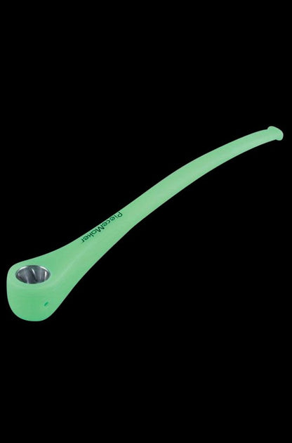 A slightly angled view of the PieceMaker Konjurer silicone pipe, showcasing its curved design and smooth, dark surface.