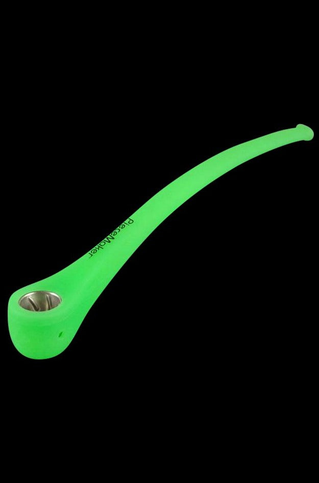 A front view of the PieceMaker Konjurer silicone pipe, showcasing its curved shape and smooth, green finish.
