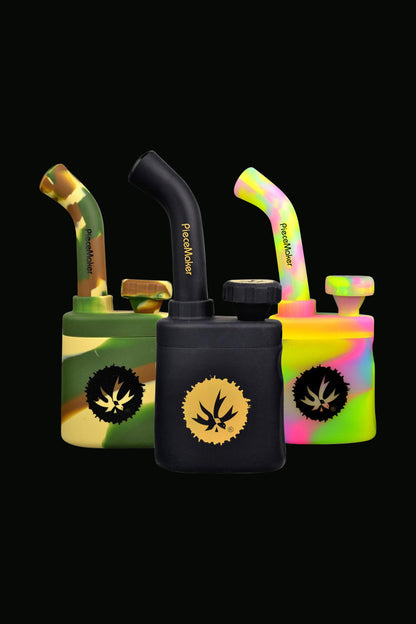 Front view of the Piecemaker "Klutch" Silicone Water Pipe, showing its colorful, textured design against a dark background.