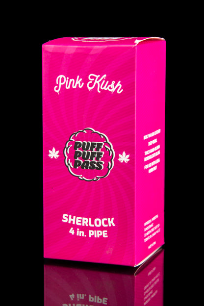 Pink box for “Puff Pass” Sherlock 4-inch pipe, featuring cannabis leaf graphics and text indicating it's for herbal use only.