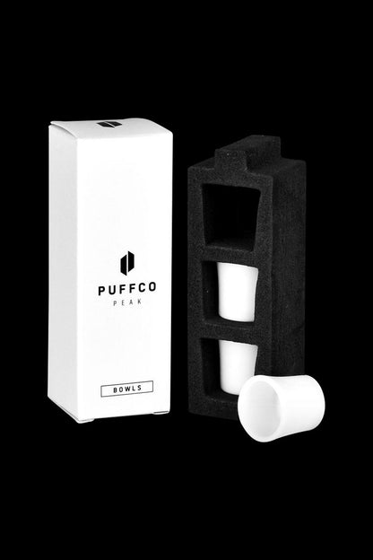 A close-up of the Puffco Peak Replacement Ceramic Bowl - 3 Pack, showing the white ceramic bowls neatly arranged in their packaging.