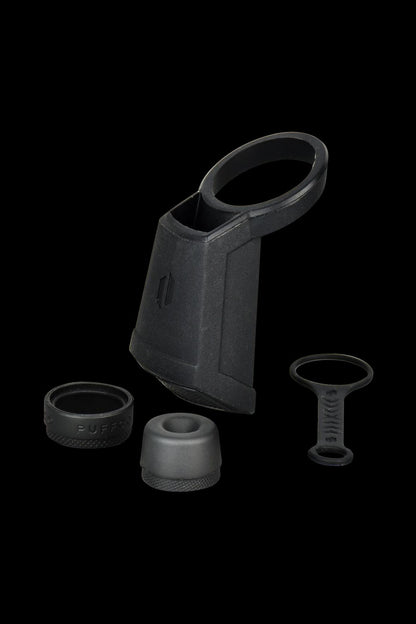 A close-up shot of the black Puffco Peak Travel Pack, displaying its carrying case and included accessories on a plain white background.