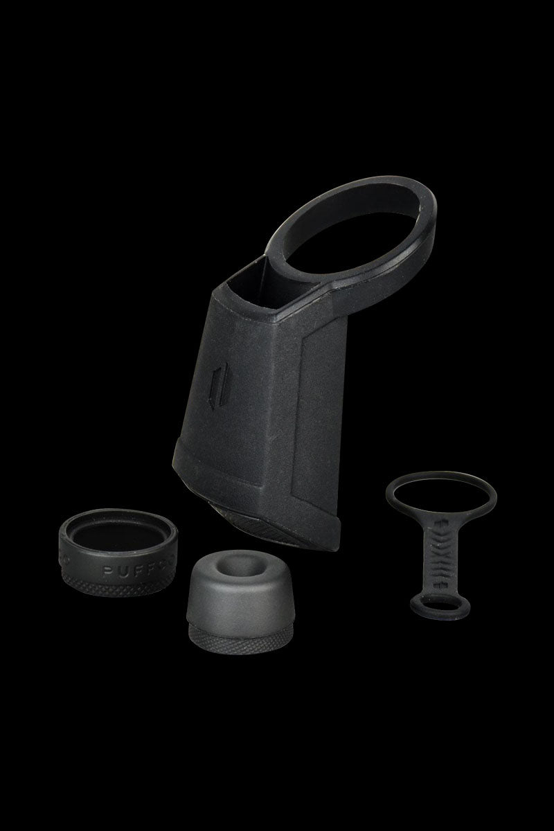 A close-up shot of the black Puffco Peak Travel Pack, displaying its carrying case and included accessories on a plain white background.