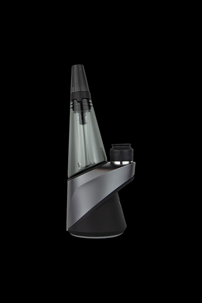 A three-quarter view of the Puffco Travel Glass for Peak & Peak Pro, showing its clear glass construction and sleek, portable design.