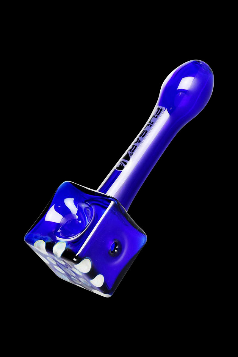 A three-quarter view showcases the Pulsar Cube Universe Spoon Pipe in vibrant blue glass, displaying its unique geometric shape.