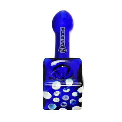 A close-up shows the Pulsar Cube Universe Spoon Pipe in blue glass, with a speckled pattern resembling stars.