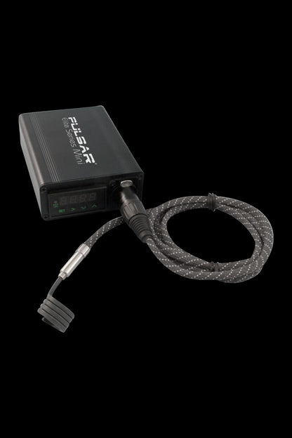 A close-up shot of the Pulsar "Elite Series" Mini eNail Kit with Universal Nail, displaying its black box and coiled cord against a dark background.