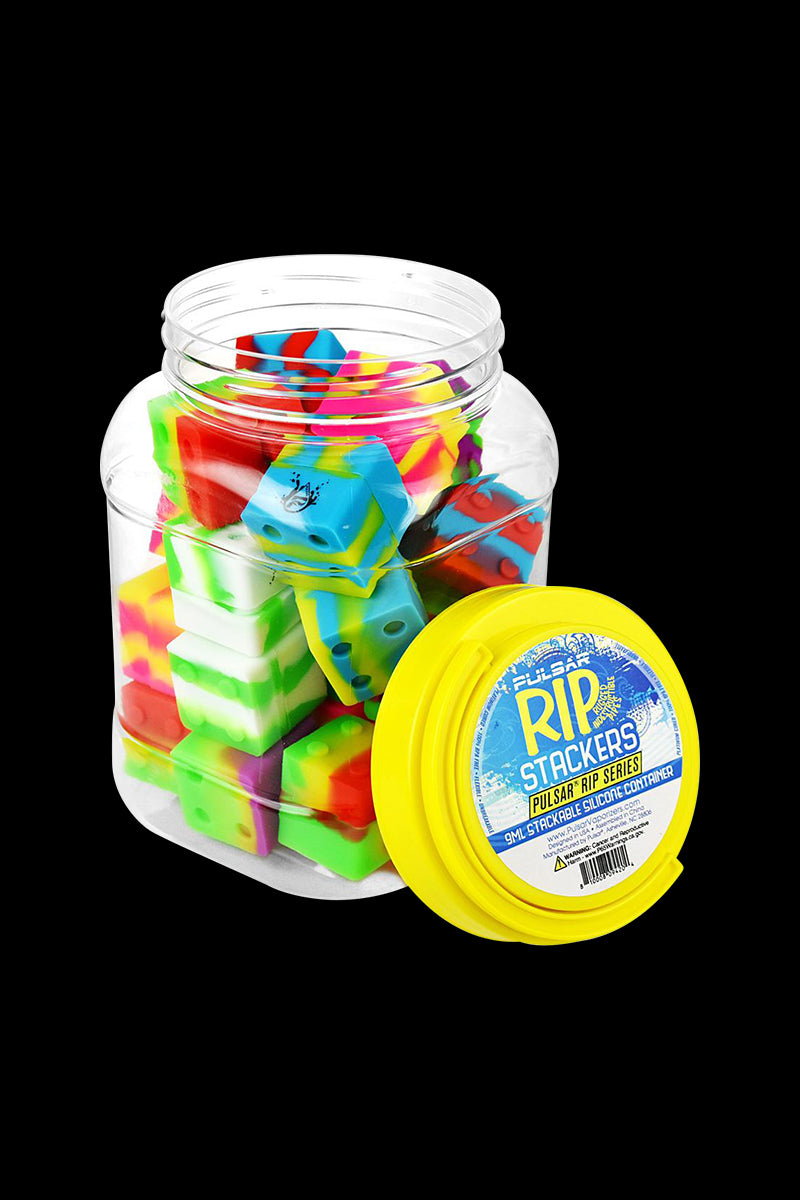 A stack of colorful 25-piece Pulsar RIP Series Silicone Dab Containers angled against a dark background.