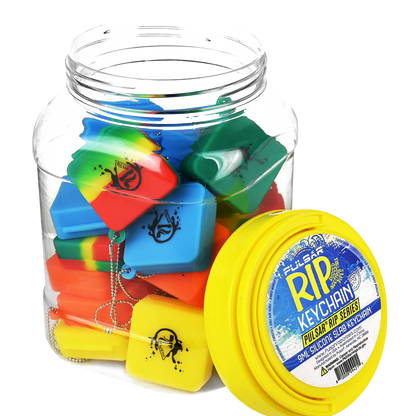 A bulk assortment of colorful Pulsar Silicone Dab Slab Containers is displayed in a top-down view, highlighting the vibrant mix of colors and simple shapes.