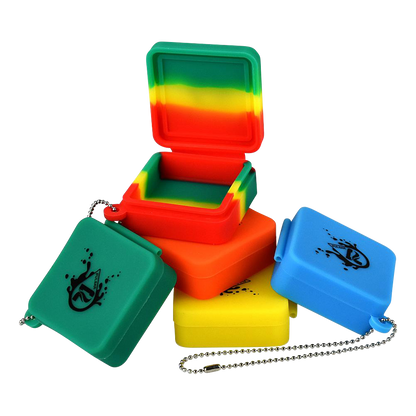 A bulk assortment of Pulsar Silicone Dab Slab Containers are stacked in a slightly angled top-down view, showcasing vibrant color variations.