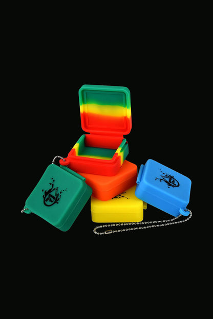 A high-angle view of the Pulsar Silicone Dab Slab Container, showing a stack of colorful, flexible silicone containers.