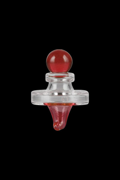 A close-up, angled view of the Pulsar UFO Directional Carb Cap, showcasing its transparent design and rounded shape.