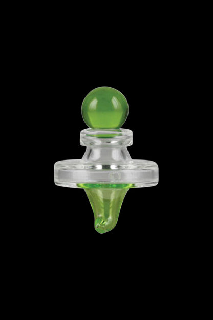 A close-up shot of the Pulsar UFO Directional Carb Cap, displaying its rounded, translucent green form against a dark backdrop.