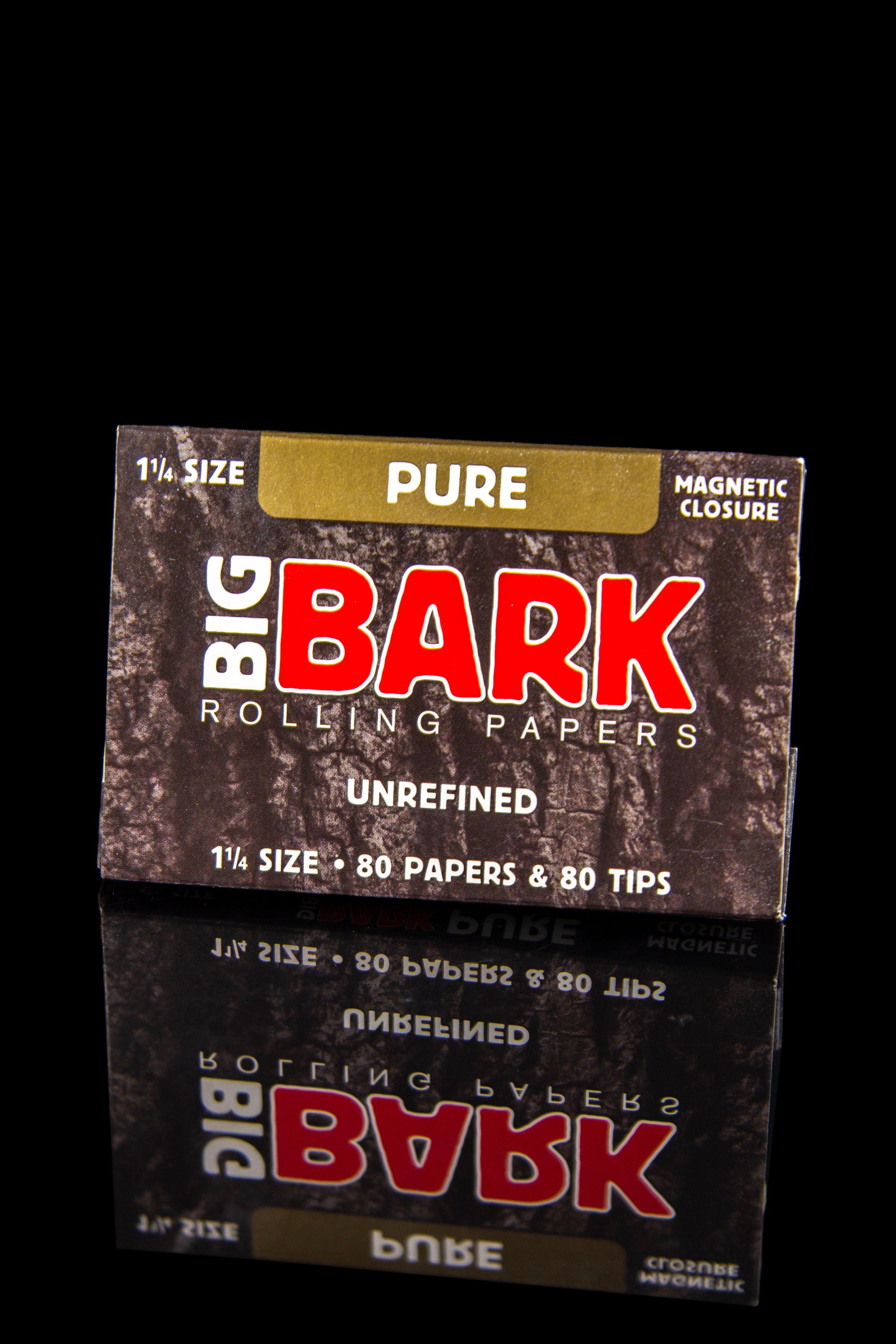 Pack of “Big Bark” rolling papers and tips against a dark background.