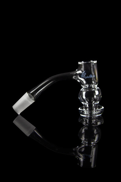 Clear glass bubbler with angled mouthpiece and textured body, reflecting on a black surface.