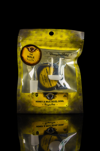 A sealed, metallic gold bag for a “Honeybee Herb” smoking bowl, featuring branding and product details.