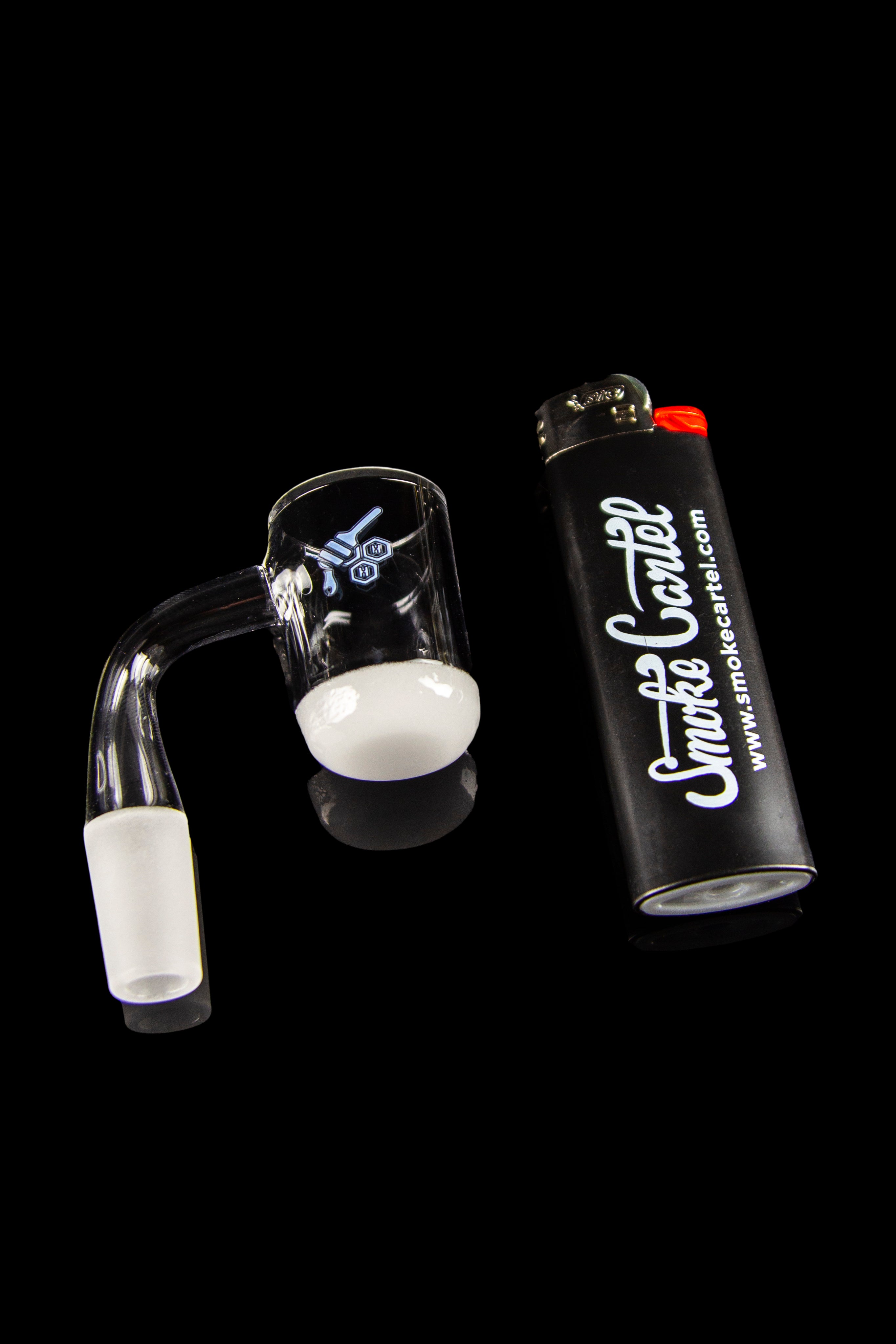 Dab rig and butane torch for cannabis concentrate vaporization.