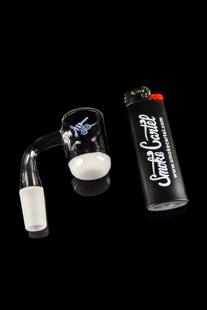 Dab rig and butane torch for cannabis concentrate vaporization.
