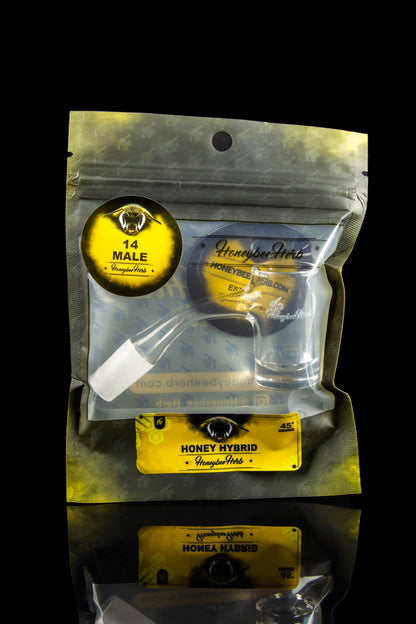 Sealed mylar bag of “Honey Herb” cannabis, displaying branding and product information, with reflections on a glossy surface.