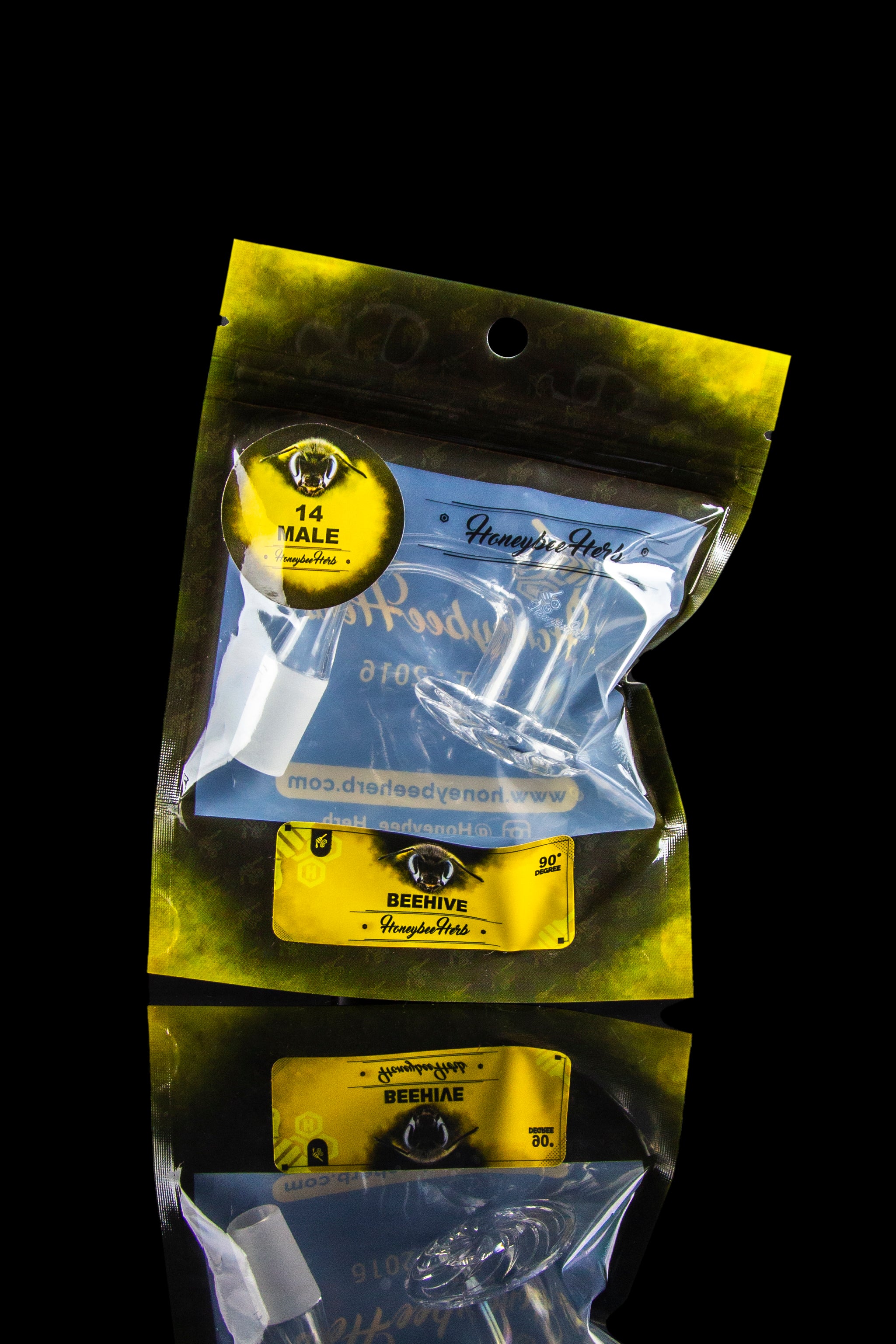 Close-up of sealed, metallic cannabis packaging with eye-shaped branding and product information.