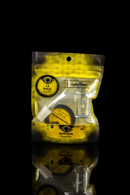 A sealed, metallic yellow bag of “Honeybee Herbs” cannabis, stacked with a similar bag below, against a black background. 