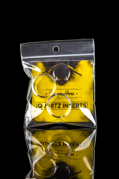 Yellow plastic bag labeled "Quartz Inserts" with a bee illustration, containing a curved, gold-colored quartz insert for dabbing cannabis concentrates.